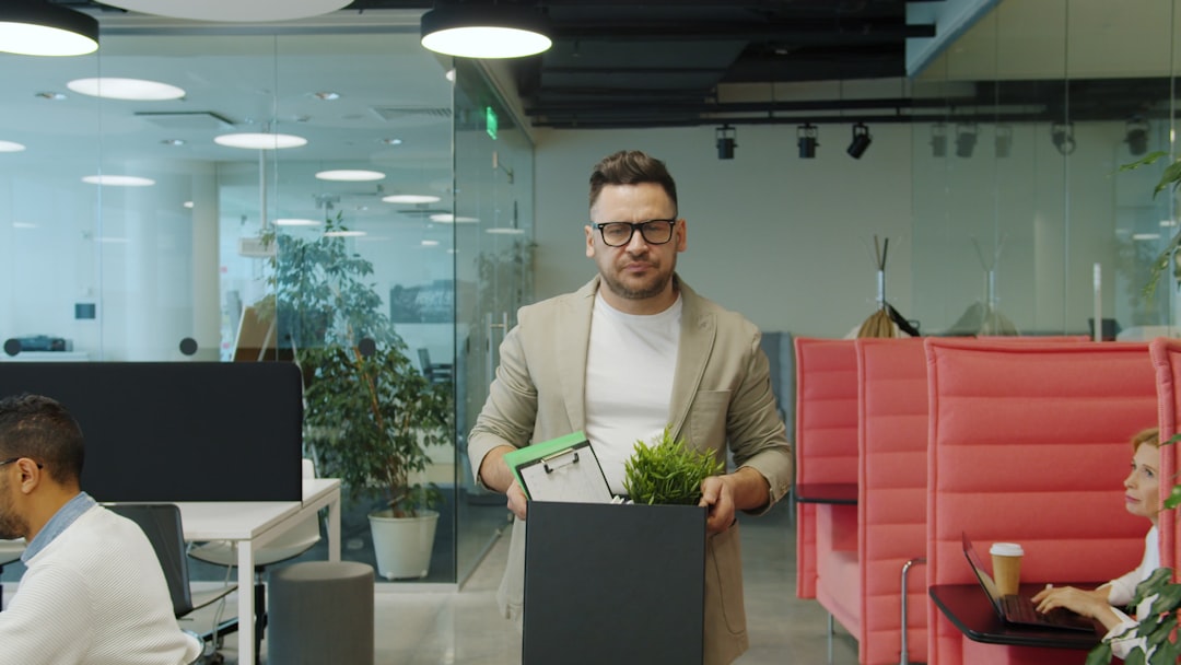 Two people waiting in an office lobby