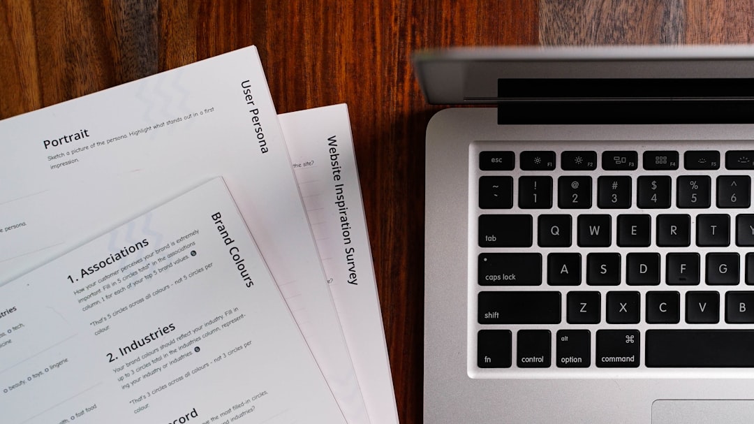 a woman is reading a resume at a table